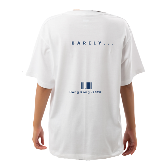 A white short-sleeve T-shirt shown from the back on a model, featuring blue printed text that reads 'BARELY...' and at the bottom Lil.Lulu, Hong Kong 2026